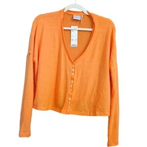 Urban Outfitters Out from under orange oversized cardigan. Size small NWT
